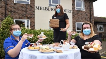 Local house builder brings tea-licious donation to Durham care home